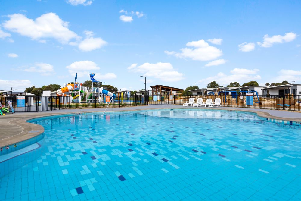Large swimming pool with waterpark in background at Goolwa