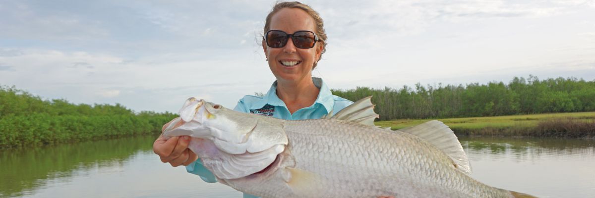 lady holding a fish 
