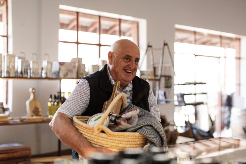 Man with shopping basket at High Country Cheeseworld